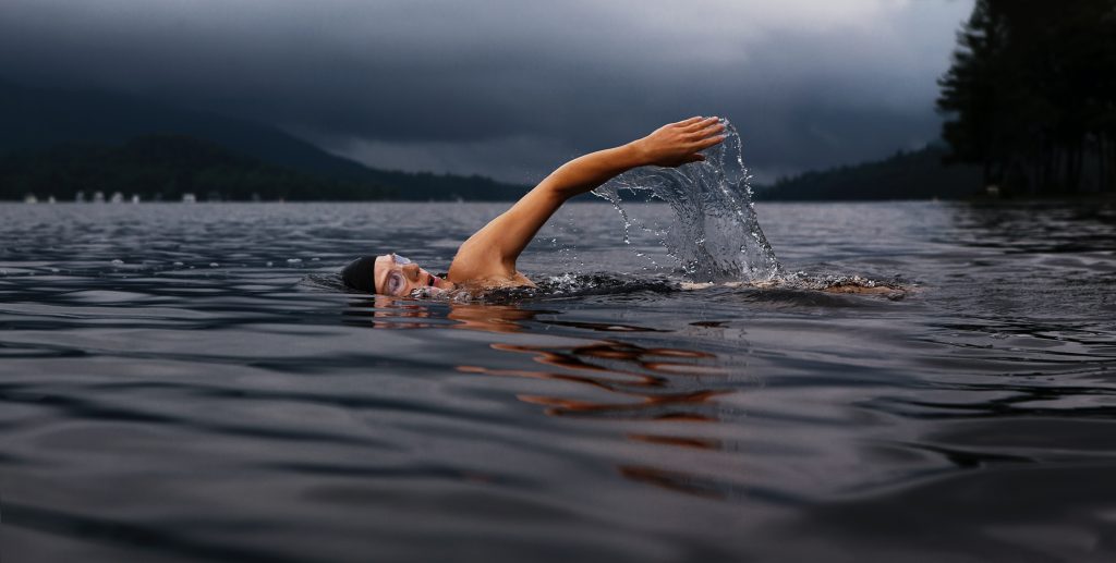 Image of someone swimming in open water.